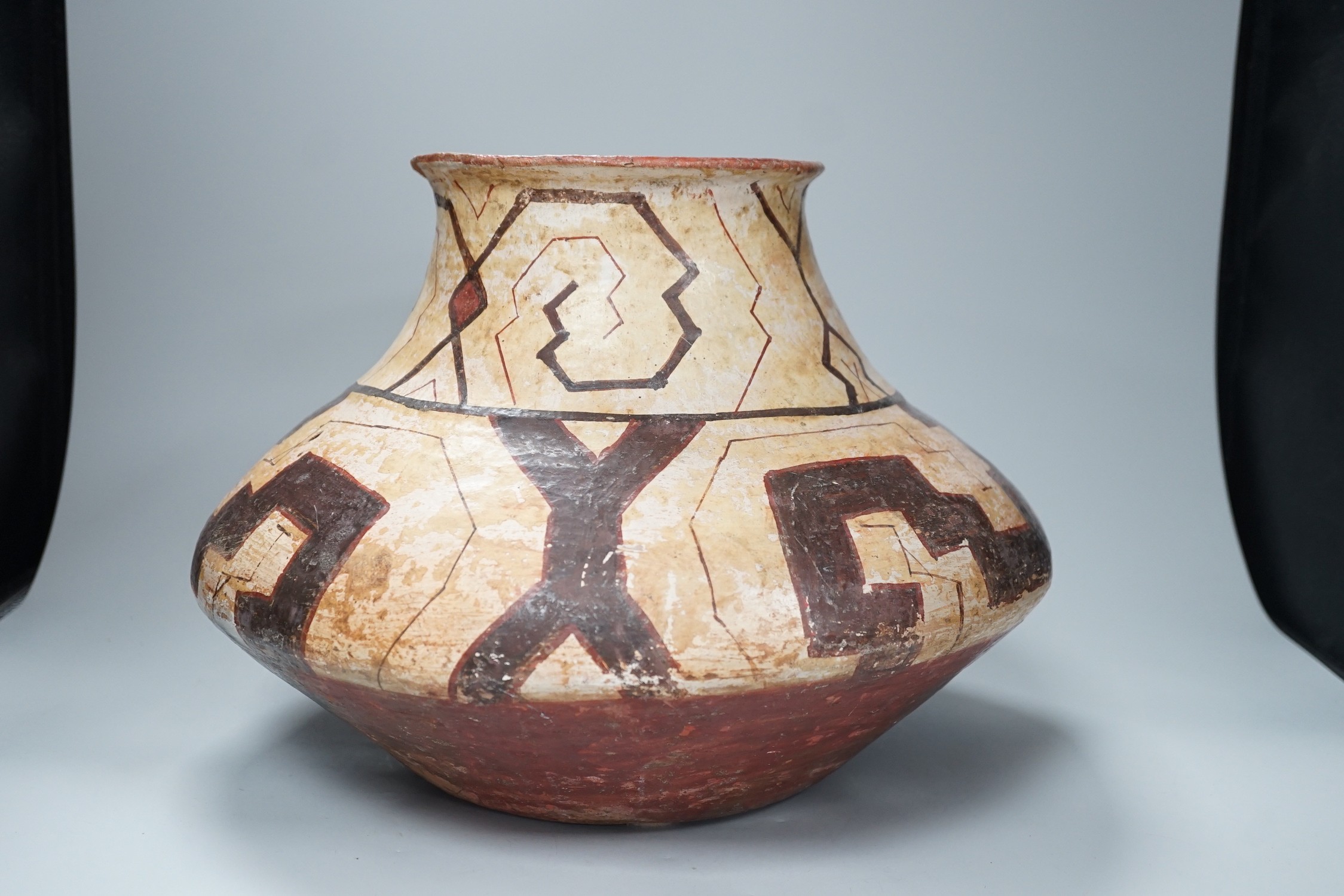 A Shipibo pottery water vessel with geometric pattern, Peru, 26cm tall